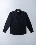 Black shirt with a blue label on a light gray background - sleeves studios - black Button-up shirt