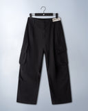 Khaki cotton baggy pants with high-waisted street fit, elastic back waistband, side and back pockets, zipper fly, and relaxed drape for everyday comfort by Sleeves Studios