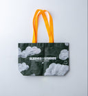 Cloud print laminated PP woven tote bag, 130gsm, with yellow-orange straps, Sleeves Studios logo and “Pack your style, baby!” slogan, lightweight and durable for daily use