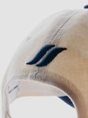 white and blue cotton cap, lightweight and breathable, SLV initials embroidered above the visor, Sleeves Studios icon on back, adjustable strap for one-size fit