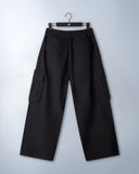 Khaki cotton baggy pants with high-waisted street fit, elastic back waistband, side and back pockets, zipper fly, and relaxed drape for everyday comfort by Sleeves Studios