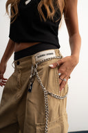 Khaki cotton baggy pants with high-waisted street fit, elastic back waistband, side and back pockets, zipper fly, and relaxed drape for everyday comfort by Sleeves Studios