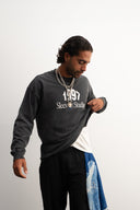 Washed grey 310gsm cotton long sleeve shirt, loose slightly cropped fit, bold “1997” graphic and Sleeves Studios logo on front, soft feel with structured drape