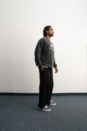 Washed grey 310gsm cotton long sleeve shirt, loose slightly cropped fit, bold “1997” graphic and Sleeves Studios logo on front, soft feel with structured drape