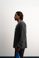 Washed grey 310gsm cotton long sleeve shirt, loose slightly cropped fit, bold “1997” graphic and Sleeves Studios logo on front, soft feel with structured drape