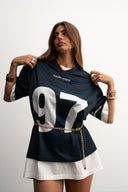 Navy mesh jersey with soft breathable texture, relaxed drapey fit, bold “97” front graphic with logo, white contrast details and double stripe on sleeve for sporty edge by Sleeves Studios