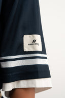 Navy mesh jersey with soft breathable texture, relaxed drapey fit, bold “97” front graphic with logo, white contrast details and double stripe on sleeve for sporty edge by Sleeves Studios