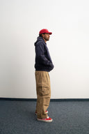 Washed navy oversized hoodie in premium heavyweight cotton, ultra-soft feel, with SLV logo and “Smile Baby” print on front, designed for comfort and vintage vibes by Sleeves Studios