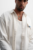 Man wearing a white shirt  - sleeves studios - white Button-up shirt - blue label - white shirt