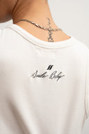 White cotton tank top, 100% cotton fabric, stretch fit, Sleeves Studios logo on back, SMILE BABY text printed