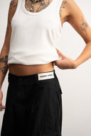 Khaki cotton baggy pants with high-waisted street fit, elastic back waistband, side and back pockets, zipper fly, and relaxed drape for everyday comfort by Sleeves Studios