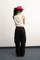 Khaki cotton baggy pants with high-waisted street fit, elastic back waistband, side and back pockets, zipper fly, and relaxed drape for everyday comfort by Sleeves Studios