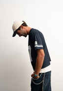 Navy mesh jersey with soft breathable texture, relaxed drapey fit, bold “97” front graphic with logo, white contrast details and double stripe on sleeve for sporty edge by Sleeves Studios