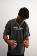 Washed grey oversized 100% heavyweight cotton t-shirt, soft and breathable with relaxed drape, brand logo and “Dream Big Baby” print, ESTD 2023 details by Sleeves Studios