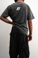 Khaki cotton baggy pants with high-waisted street fit, elastic back waistband, side and back pockets, zipper fly, and relaxed drape for everyday comfort by Sleeves Studios