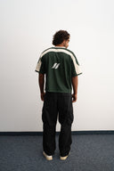 Green and white cropped mesh football jersey with boxy fit, breathable lightweight fabric, contrast shoulder panels, large “26” front print, and Sleeves Studios brand icon on back