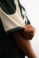 Green and white cropped mesh football jersey with boxy fit, breathable lightweight fabric, contrast shoulder panels, large “26” front print, and Sleeves Studios brand icon on back