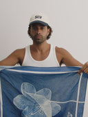 blue bandanna / headscarf  with text "tie your style baby" Sleeves Studios' branding