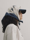  white and blue bandanna / headscarf with text "Wrap it with confidence baby"  and "Sleeves Studios" branding